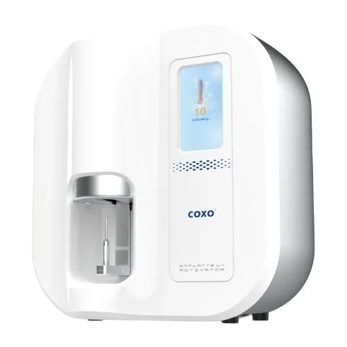 Coxo Implant Activator front view showing sleek design, LED display, and activation chamber Coxo Implant Activator front view showing sleek design, LED display, and activation chamber